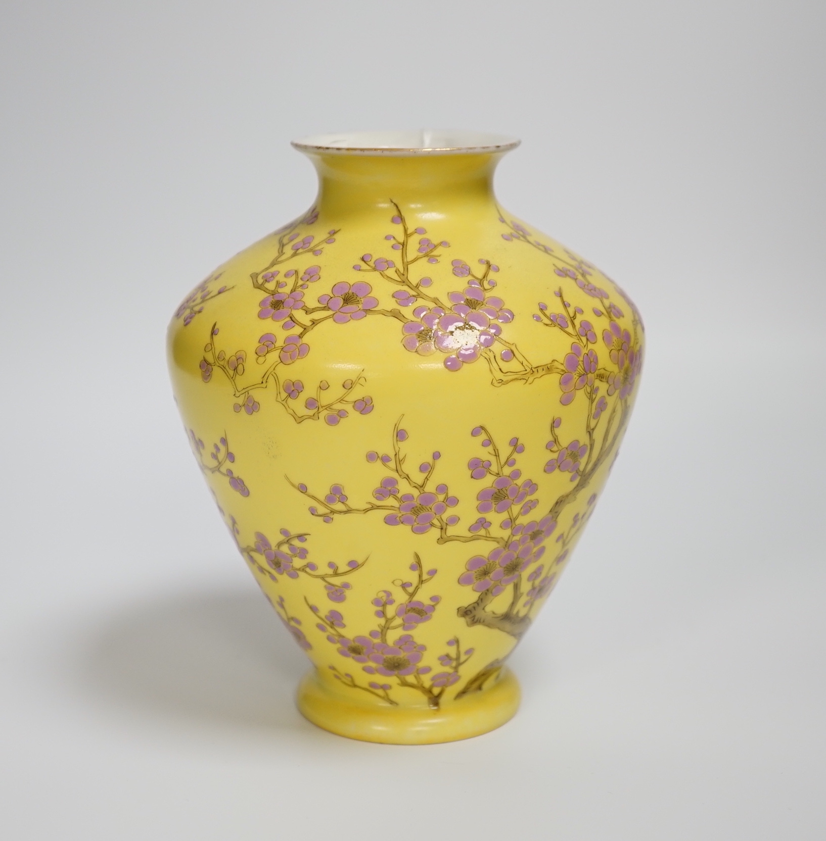 A Japanese yellow ground vase with pink cherry blossom design, 16cm